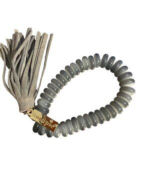 Mud Pie Stretch Bracelet Disc Beads Gray Tassel Gold Tone Sitting at 5.5"